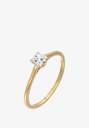 Guldsingletring med en rund klar diamant holdt af fire kløer, mærket 375 inden i båndet.