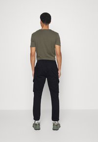 Redefined Rebel PANTS - Calças cargo - black