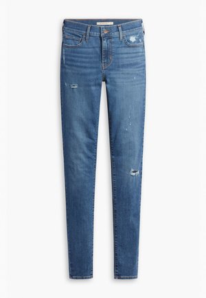 Blå denim jeans med slim fit, der har slidte detaljer, subtil falmning og en klassisk knaplukning, designet til afslappet brug.