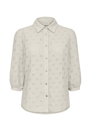 Lichtgrijze blouse met een knoopsluiting aan de voorkant, oogjespatroon en ballonmouwen. Heeft een klassieke kraag en parelachtige knopen.