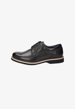 Zwarte leren dresschoen met een gladde afwerking, ronde neus, vetersluiting, witte stiksels en een rubberen zool voor grip.