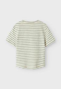 Short-sleeve shirt in light cream with horizontal grey stripes. Soft cotton material, rounded neckline, and a slightly curved hem.