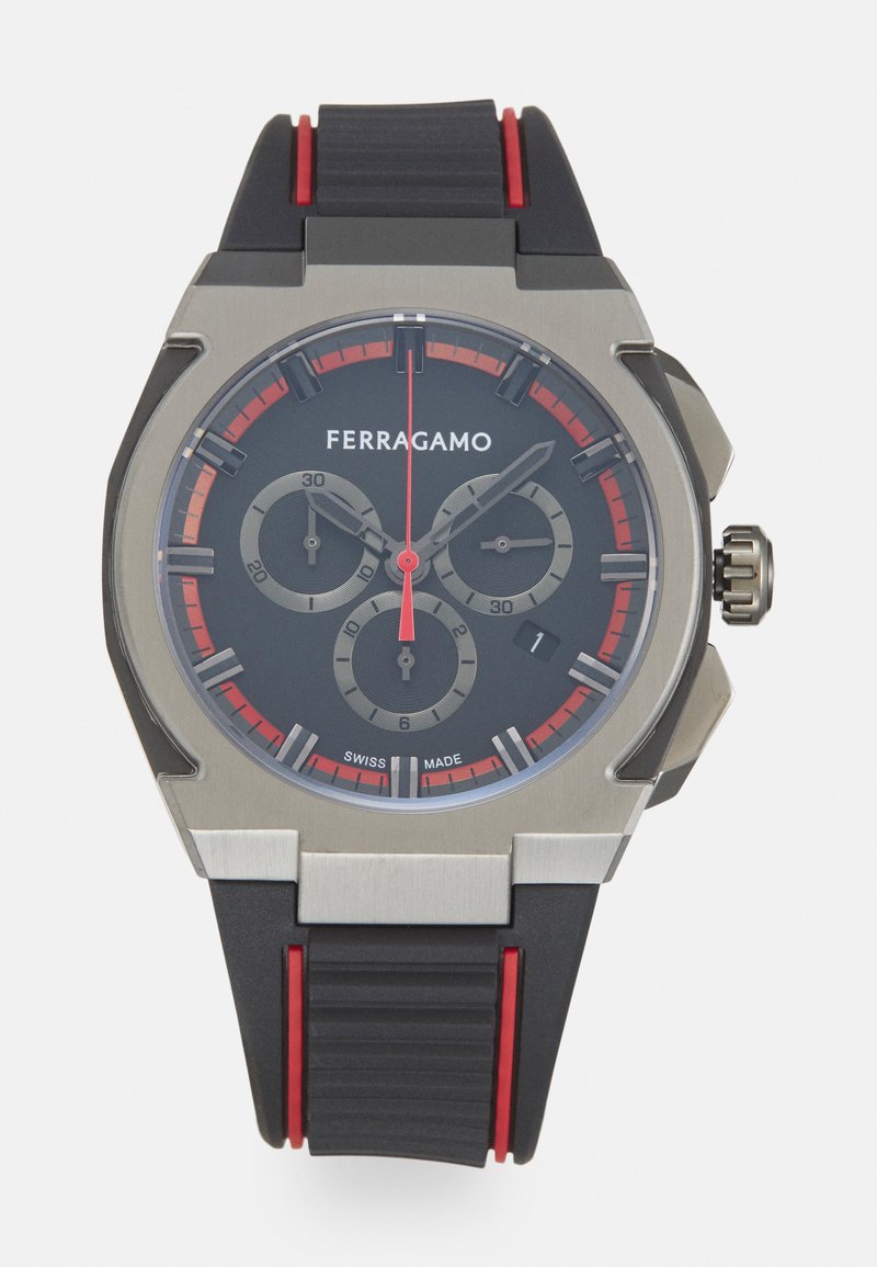 Black rubber watch with silver stainless steel case, red accents, black dial, three sub-dials, and a prominent crown for adjustment.