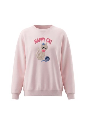 Lyserød sweatshirt med en tekstureret grå kat iført en blå hat og lyserød butterfly, blå garnnøgle og ordene "HAPPY CAT" i pink ovenover.