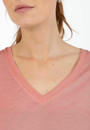 Pink V-neck T-shirt with a soft texture and relaxed fit, featuring a smooth neckline and subtle stitching detail.