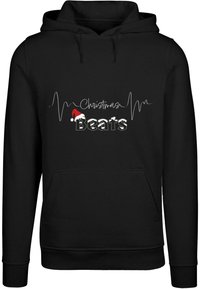 Fekete kapucnis pulóver fehér szöveggel, melyen egy szívverésvonal látható, valamint "Christmas Beats" művészi betűtípussal, piros Mikulássapkával kiemelve.