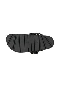 Sole di sandalo nera con pattern di grip testurizzato. Presenta cinturini intrecciati e punta arrotondata. La superficie è liscia con linee di battistrada in rilievo.