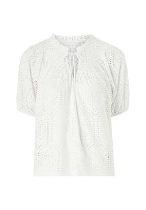 Weißes Spitzenblüschen mit Puffärmeln, einer gerafften Ausschnittkante und einer Bindeschnurbestellung vorne. Der Stoff hat filigrane durchbrochene Muster.