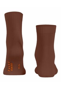 Brązowe skarpetki z teksturowanym wzorem i prążkowanymi mankietami. Posiadają pomarańczowe logo "FALKE RUN RIB" oraz oznaczenie rozmiaru. Smukły design, odpowiednie do odzieży sportowej.