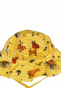 Keltainen ämpärilakki, jossa on musta raitakuosi, esittelee kuvia lehmissä, polkupyörissä ja eläinten jäljissä. Pehmeä kangas, kerätty malli.