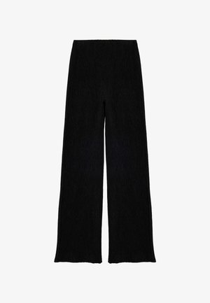 Zwarte wijde broek met een gestructureerd, geribbeld patroon. Heeft een hoge taille en een losse pasvorm, wat zorgt voor een vloeiende silhouet.