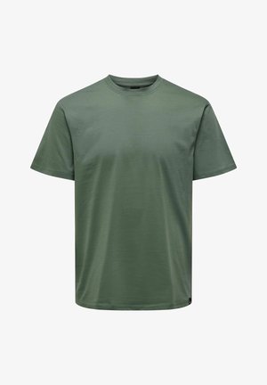 T-shirt verde-oliva com decote redondo, mangas curtas e um corte relaxado. Feita de um tecido suave e liso com um design minimalista.