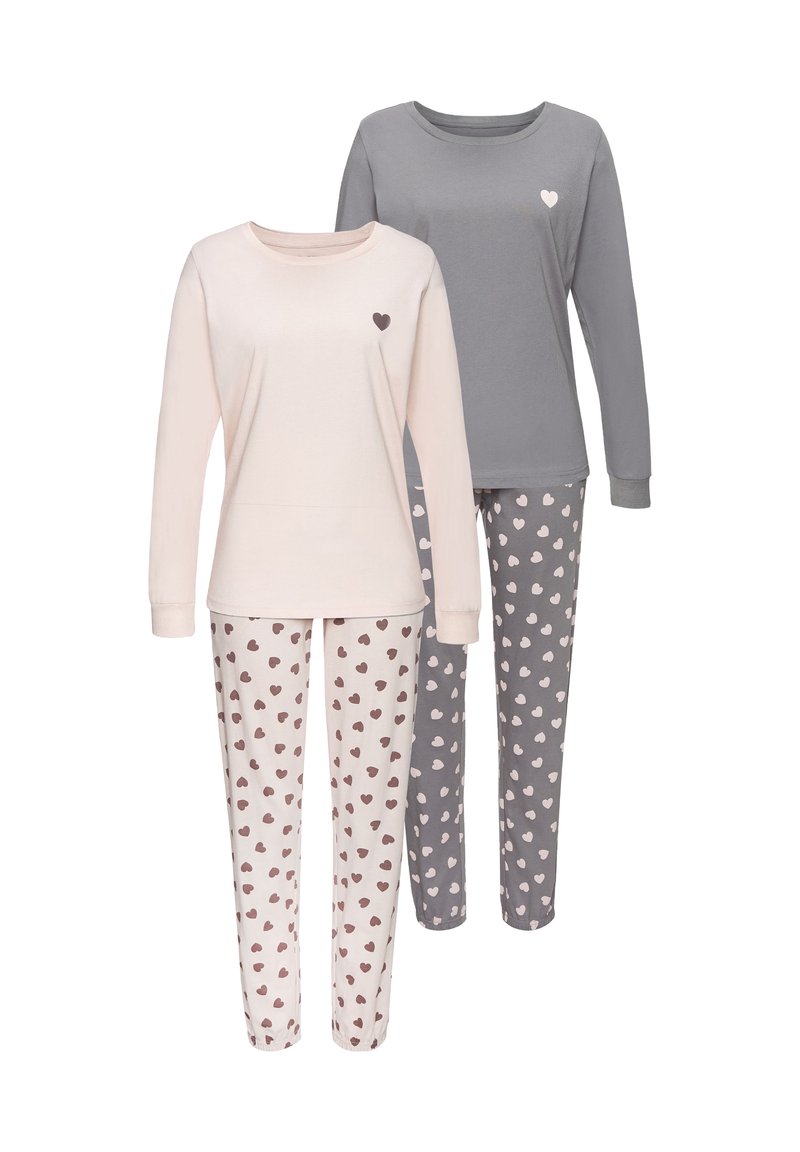 Two sets of pajamas: one light pink with small brown hearts, one gray with light pink hearts. Both feature long sleeves and pants. Soft fabric.