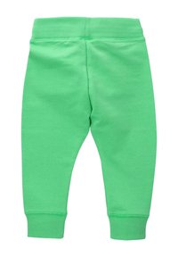 Grüne Baumwoll-Sweatpants mit einem gerippten Bund und Bündchen. Glatte Textur und taillierte Beinform. Keine Muster oder zusätzlichen Hardware sichtbar.