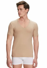 Beige V-neck t-shirt made from smooth fabric with short sleeves. Features a fitted design and minimal stitching details.