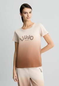 Short-sleeve t-shirt in a gradient of beige to brown, featuring "LIU JO MILANO" logo in a dotted design. Soft fabric, relaxed fit.