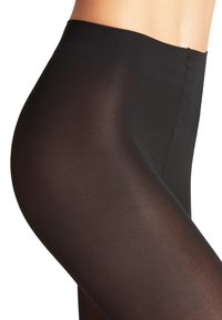 Sorte, gennemsigtige leggings med en glat, mat tekstur. Taljen er bred og elastisk, designet til en tætsiddende pasform. Sømdetaljerne er minimale.