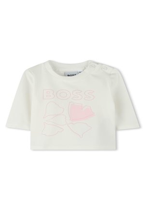 Witte T-shirt met korte mouwen en ronde halslijn, met een roze bloemenprint en de tekst "BOSS". Drukknopen op de schouder voor gemakkelijk aan- en uittrekken.
