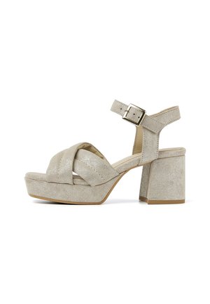 Beige platform sandaler med en struktureret ruskindsfinish. Har et bredt krydset rem, justerbar ankelspænde og chunky firkantet hæl.