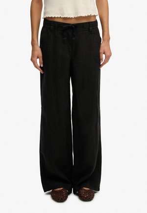 - Spodnie materiałowe