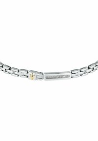 Bracciale d'argento con design a catena, caratterizzato da un accento in oro e un centro rettangolare decorato con pietre trasparenti.