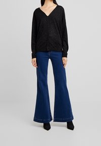 Sisley Stickad tröja - black