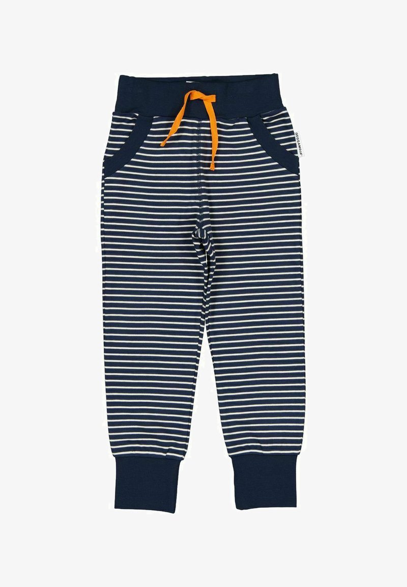 Tummansinisiä raidallisia housuja, joissa on valkoiset raidat, joustava vyötärönauha oranssilla nyörillä ja sivutaskut. Housujen lahkeet ovat kankaan alareunassa.