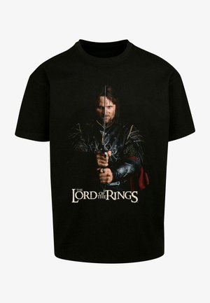 Zwarte katoen t-shirt met een afbeelding van een personage dat een zwaard vasthoudt, met de grafische tekst "The Lord of the Rings" onder de afbeelding.