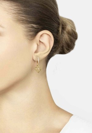 Gold hoop earring featuring a diamond-shaped, openwork design with a textured surface and a small accent stone in the center.