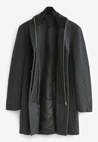 Grå ullblandad kappa med en strukturerad design, med dragkedja fram, två sidofickor och en slät svart foder. Knappar som accentuerar ärmarna.