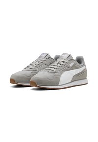 Gray suede sneakers with white accents, featuring a rounded toe, lace-up design, and a brown rubber sole for traction.
