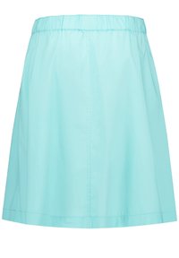 Una falda ligera, fácil de poner, en un color azul claro sólido, que presenta una cinturilla elástica y una silueta recta. Tejido suave y brillante.