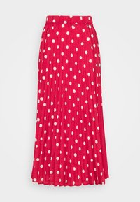 Jupe plissée rouge à pois blancs. Présente une taille élastique et une coupe fluide. Tissu doux avec une texture lisse.
