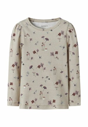 Beige long-sleeve toddler shirt with puffed shoulders, decorated with small purple flowers and mushroom patterns.