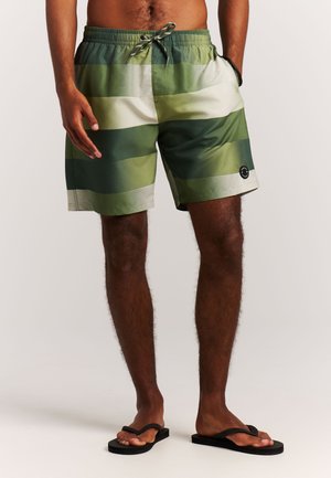 Heren zwemshorts in groen en beige strepen, met een elastische tailleband met trekkoord en een klein logoplaatje aan de onderkant links.