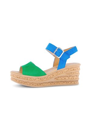 Wedge sandals with green suede front and blue faux leather ankle strap, featuring a textured tan cork sole for grip.