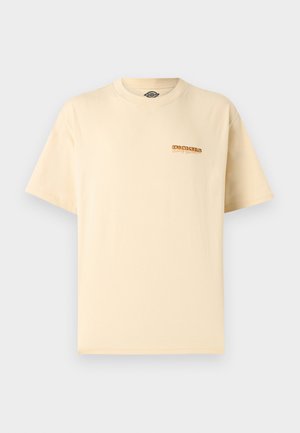 T-shirt beige à manches courtes Dickies avec petit logo orange et noir sur la poitrine gauche, encolure ronde, design uni.