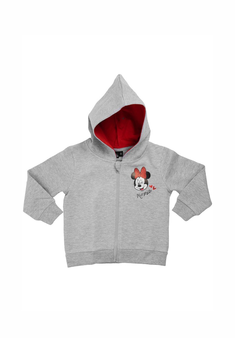 Felpa grigia con zip e interno rosso, caratterizzata da un'illustrazione del volto di un personaggio e dalla scritta "Minnie" in nero. Include maniche lunghe e cappuccio.