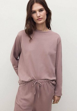 Maglietta a maniche lunghe con scollo tondo e pantaloni con coulisse in morbido tessuto rosa. Texture liscia con vestibilità rilassata e design minimalista.