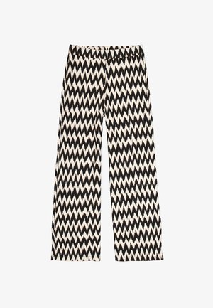 Pantalon large noir et crème avec un motif en zigzag, fabriqué dans un tissu texturé doux avec une taille élastique pour plus de confort.