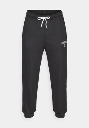 Black sweatpants made of cotton blend, featuring an elastic waistband with a white drawstring and cuffed hems. Small logo on the side.