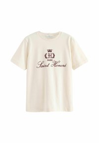 Tejbélelt, rövid ujjú krémszínű pamut póló, középen elhelyezett bordó nyomott logóval és "H Paris Saint Honoré" felirattal.