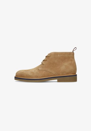Tan suede ankle boot with lace-up front, blue trim midsole, and brown rubber sole, shown in right profile on white background.