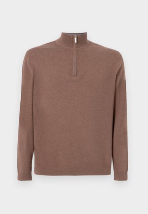 Pruunist lõngast kudum, millel on kõrge kaelus ja osaline tõmblukk. Omab pikki varrukaid ja soonikkoes mansette. Sile tekstuur.