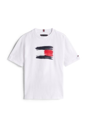 White cotton t-shirt featuring a brushstroke graphic in black, red, and white. Round neckline and short sleeves. Tommy Hilfiger logo on sleeve.