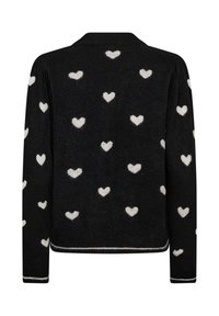 Svart tröja med en mjuk textur och vita hjärt-mönster över hela. Inkluderar en ribbad nederkant och ärmslut med vita accenter.