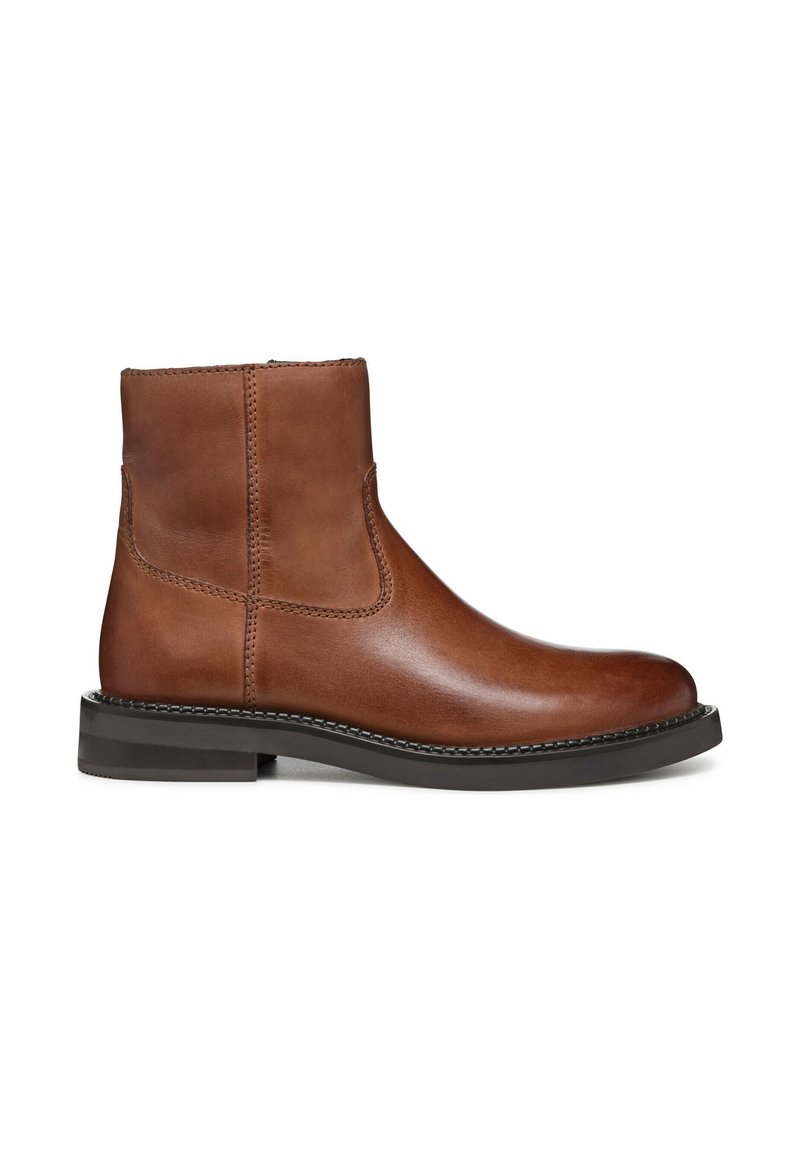 Brown leather ankle boot with a smooth finish, elastic side panels, and a low block heel. Features contrasting stitching along the seams.