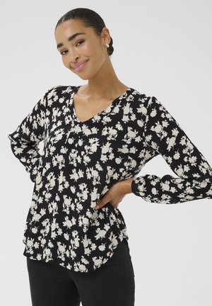 Schwarze Bluse mit floralen Mustern in Weiß, V-Ausschnitt und langen Ärmeln. Strukturierter Stoff, lockere Passform und abgerundeter Saum.