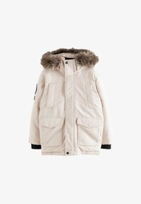 Parka beige claro con capucha forrada de piel, bolsillos delanteros con botones a presión y puños acanalados. Tejido suave con una textura ligeramente acolchada.