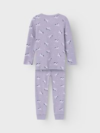 Purple pajama set featuring a unicorn print, made from soft ribbed fabric. Includes long-sleeved top and fitted pants with cuffed hems.
